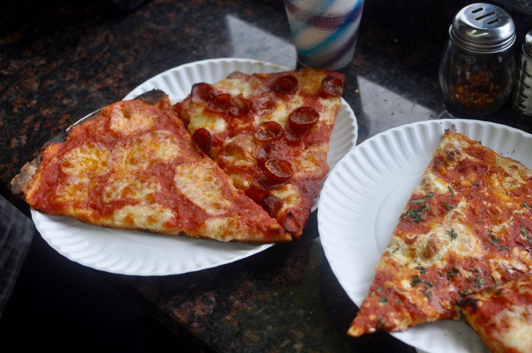 Paulie's Pizzeria, the newest kid on the block, has quickly shown its might, dishing up cracker-crust pies with a sweet tomato sauce. Photo by Mary Bakija for the Village Voice.