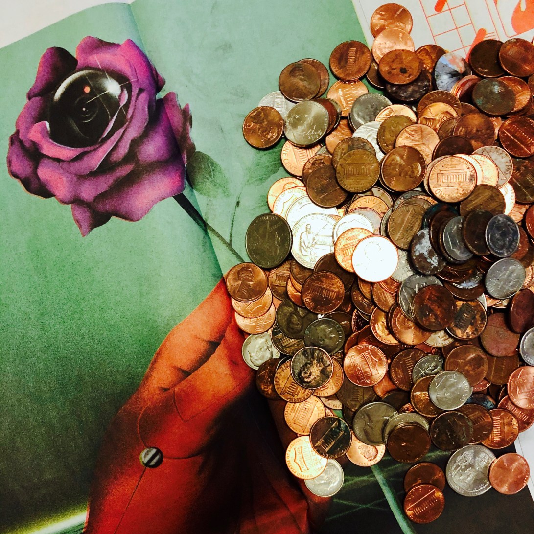 pile of US coins on a newspaper